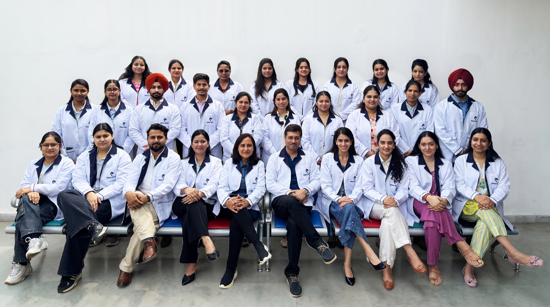 Autism Alliance multidisciplinary team gathered together in white clinical coats